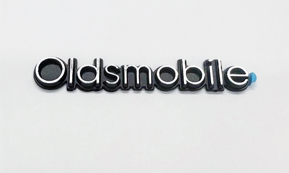 1978-80 Cutlass "OLDSMOBILE" Header Panel Emblem - Adhesive Backed Replaces GM 555744